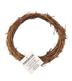 a grapevine wreath with a tag hanging from it's center, on a white background