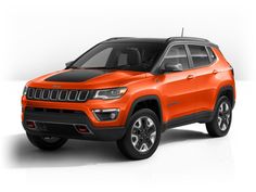 an orange jeep compass parked in front of a white background