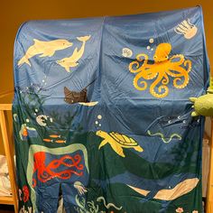 a child's bed with an ocean theme on it