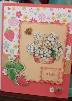 a card with flowers and strawberries on it