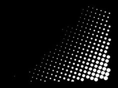 an abstract black and white background with halftone dots in the shape of a triangle