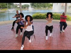 group of people dancing in front of water fountain