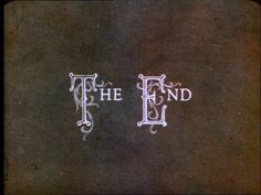 the end and f is written in white on a black background with swirly lines