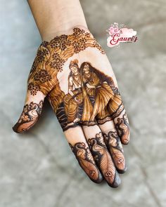 a woman's hand with hennap and tattoos on her hands, showing the design