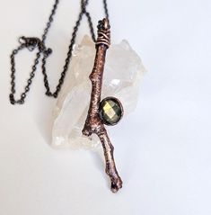 This is a faceted labradorite real twig necklace. The pendant was plated in a thick layer of copper then given an antique finish. The pendant height is approximately 2.5 inches with a .5 inch width. It hangs from a gunmetal chain in your choice on length. The pendant was hand shaped, polished, and sealed to prevent tarnishing. You will receiving the exact necklace pictured, it's ready to ship! Message me if you have any questions or if your interested in a custom order (: Luxury Electroformed Necklaces As A Gift, Earthy Electroformed Bronze Necklace, Rustic Bronze Electroformed Necklace, Antique Electroformed Pendant Jewelry, Antique Electroformed Pendant Necklace, Boho Statement Necklace, Crystal Necklaces, Hand Shapes, Necklace Boho