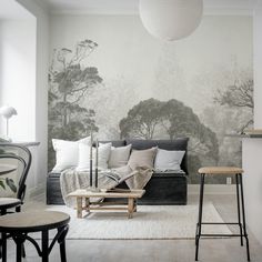 a living room with a couch, table and chairs