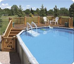 an above ground swimming pool with steps and railings