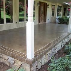 the front porch is covered with concrete