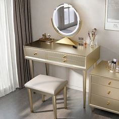 a dressing table with a mirror and stool