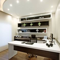 an office with a white desk and wooden floors