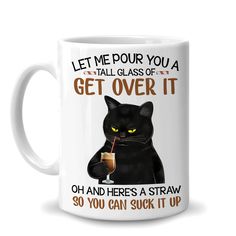 a white coffee mug with an image of a black cat holding a drink in it's mouth