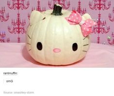 a hello kitty pumpkin with a bow on it