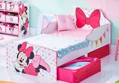 a child's bedroom with minnie mouse furniture