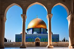 the dome of the rock in the middle of an open courtyard with columns and arches