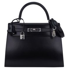 Mightychic offers an Hermes Kelly Sellier 28 bag featured in rare Black Box leather. Considered to be of the most collectible hertiage leathers from Hermes, this timeless beauty exudes chic style. Fresh with Palladium Hardware. Divine size for day to evening. Comes with shoulder strap, sleepers, lock, keys and clochette, and signature Hermes orange box. NEW or NEVER WORN. final sale BAG MEASURES: LENGTH 28 cm / 11" TALL 20.5 cm / 8.25" DEEP 11 cm / 4.5" HANDLE: TALL 5" CONDITION: NEW or NEVER WO Hermes Kelly 25 Black, Hermes Kelly 25, Hermes Lindy, Orange Box, Hermes Orange