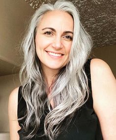 Long gray hair is a thing of beauty, and these inspirational photos prove that it's gorgeous at any age! In this post, I show off a variety of long gray hairstyles for women of all ages and teach you how to take care of your long grey hair as well. Don't let that old rule about no long hair after 40 get you down - rules are made to be broken! And if you think you're too young to wear gray hair? Think again - these beautiful ladies will show you how long silver hair works for everyone! Grey Hair Under 40, Grey Hair Young, Grey Long Hair, Going Gray Gracefully