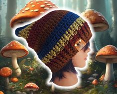 a crocheted hat with two colors on it and mushrooms in the woods behind it