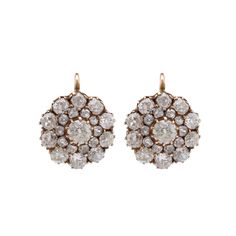 Center Stone: 42 Diamonds Cut: Old Mine Cut Weight: 6.06 Carats Color: I-J Clarity: SI Metal: 18K Yellow Gold Era: Modern Circa: 2020's in theAntique Style Hallmarks: Stone Weight Engraved Size: 7/8 x 5/8 inches Gram weight: 5.48 These elegant earrings feature 42 dazzling old mine cut diamonds, totaling 6.06 carats. The diamonds, with their I-J color and SI clarity, are set in 18K yellow gold, offering a timeless and sophisticated look. Crafted in the modern era but styled to reflect antique charm, these earrings are a tribute to classic elegance. Measuring 7/8 x 5/8 inches and weighing 5.48 grams, they are perfect for adding a touch of vintage-inspired brilliance to any outfit. The stone weight is engraved, ensuring the authenticity and quality of this exquisite pair. Antique Brilliant Cut Diamond Earrings, Victorian Rose Cut Diamond White Earrings, Luxury Antique Brilliant Cut Diamond Earrings, Victorian Rose Cut Diamond Earrings, Vintage Brilliant-cut Diamond Earrings, Antique Diamond Earrings, Colored Stone Engagement Rings, Yellow Gold Cocktail Ring, Unique Rings Vintage