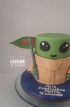 a cake made to look like the child yoda from star wars