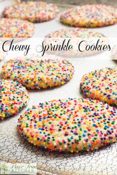 there are many sprinkle cookies on the table