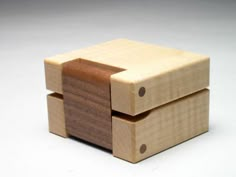 two wooden blocks stacked on top of each other