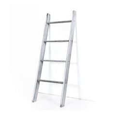 a ladder leaning up against a white wall