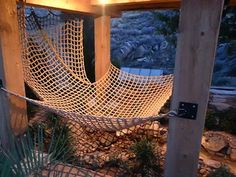 a hammock hanging from a wooden structure