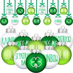 green and white christmas ornaments with shamrocks hanging from the top one is for patrick's day