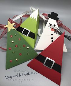 three paper christmas trees on top of each other