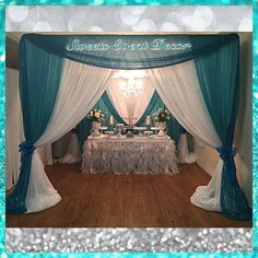 an image of a table set up for a wedding reception with blue and white decor