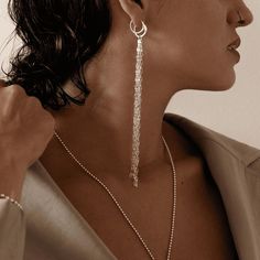 About this item Crafted from premium 925 sterling silver, these stunning mono waterfall earring bring a sense of wild, fluid movement to your look, offering the perfect balance between elegance and boldness. The cascading chains catch the light with every step, creating a dynamic and eye-catching effect. Made of sterling silver 925 Measurements: Waterfall size: 5.5" / 14cm Ring size: 14mm ● The price is for a one Mono earring. ● Want to see more jewelry from my shop?  https://www.etsy.com/shop/MURJewelryStore ● The item will be beautifully wrapped, as shown in the last picture of the listing, and ready for gifting! Our packaging includes an eco-friendly gift box and a reusable protective case that shields the jewelry from friction and scratches. Each piece is handcrafted in Bali from high- Fluid Movement, Tassel Earring, Tassel Fringe, Eco Friendly Gifts, Silver Earring, 925 Sterling Silver Earrings, Jewelry Handmade, Tassel Earrings, Silver 925