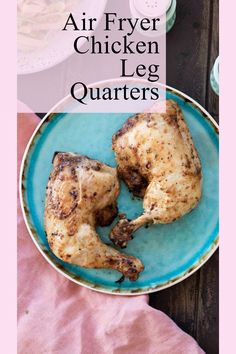 two chicken legs on a blue plate with the words air fryer chicken leg quarters