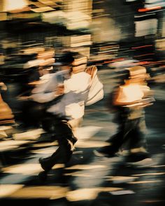 blurry photograph of people crossing the street