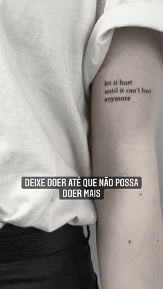 a person with a quote tattooed on their arm