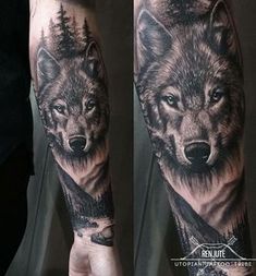 a man's arm with a wolf tattoo on it and trees in the background