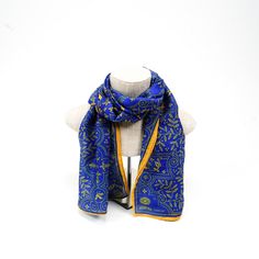 Royal blue is matched with gilt gold to produce an elegant design of detailed line-work. Let others revel at your royal scarf, as you relish the rightful admiration over your fine fashion taste. Inspiration: Poetical Works of Byron, c.1900 Classic Gold Silk Scarf, Elegant Ceremonial Shawl, Gold Shawl For Formal Festive Occasions, Traditional Silk Scarves For Formal Occasions, Formal Festive Gold Shawl, Traditional Silk Scarf For Formal Occasions, Traditional Formal Silk Scarf, Luxury Blue Silk Scarves, Luxury Blue Silk Scarf