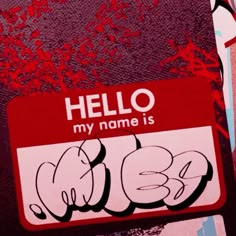 a hello my name is sticker on the side of a car door window with graffiti