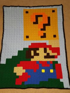 a blanket made to look like an old video game character