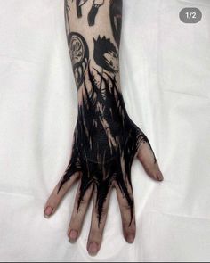 a person's hand with black ink on it