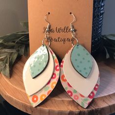 These 3 Layered Earrings Were Handmade Using Scrapbook Paper Which Was Adhered To A Wooden Pendant. The 1st And 3rd Layer Are Decoupaged Fronts With The Back Hand Stained A Dark Walnut Finish. The 2nd Layer Was Hand Painted With White Chalk Paint. Each Front Has A Glossy Glaze. Earring Hooks Are Nickel Free/Hypoallergenic And Come With A Clear Silicone Stopper. Each Earring Will Have Slight Variations From The Other As They Are Handmade. Stain May Vary Due To Natural Wood Grain. *Please Remove E Hello Kitty Earrings, Silver Crystal Earrings, White Flower Earring, White Gold Earrings Studs, Feather Decor, Painted Earrings, Earring Trends, White Chalk Paint, Heart Dangle Earrings