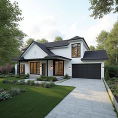 a white house with black shingles and lots of windows in the front yard area