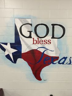 a mural painted on the side of a building with words god, blessing, and texas