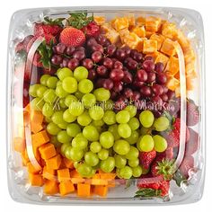 a plastic container filled with lots of different types of fruits and veggies on top of each other