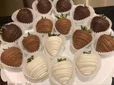 chocolate covered strawberries are arranged on a white platter, ready to be eaten