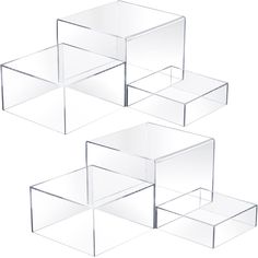 three clear boxes are stacked on top of each other