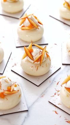 small desserts with orange and white decorations on them