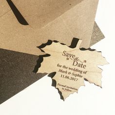 save the date card with maple leaf cut out on it's front and back