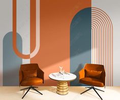 two chairs and a table in front of a wall with an abstract design on it