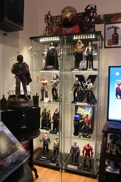 a display case filled with action figures and toys