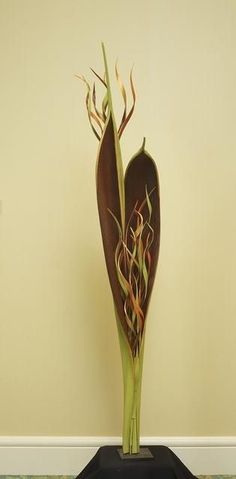 a vase with some flowers in it on a table